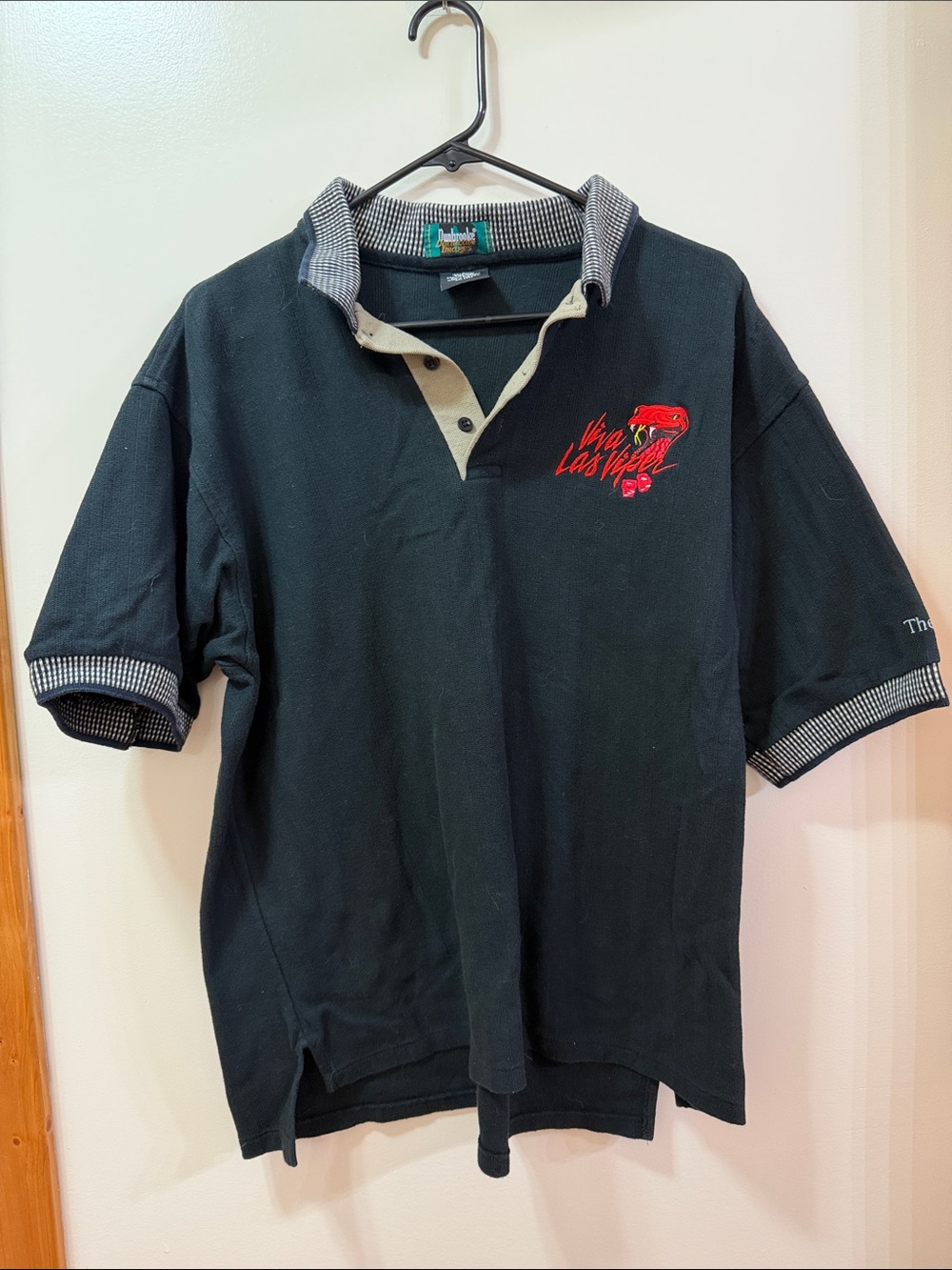 Dunbrooke Black Polo with Red Sneak Logo Patch. NWOT Size Large
